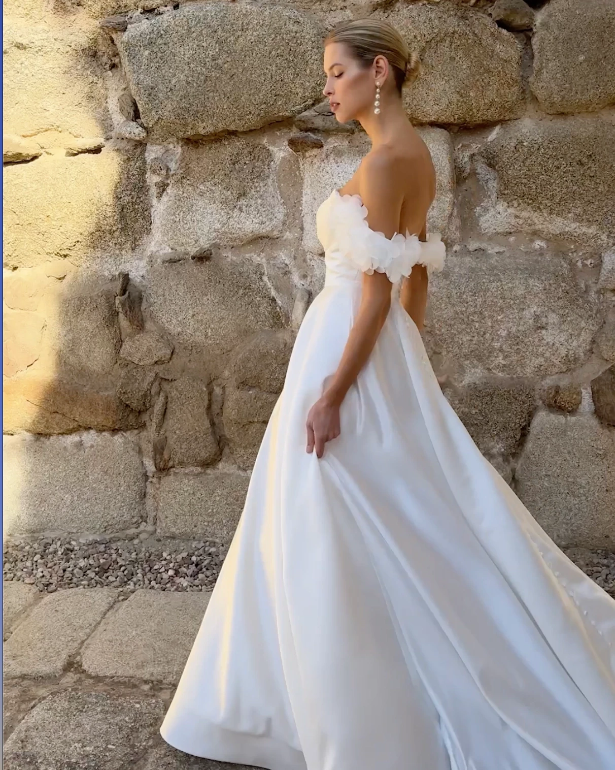 Photo of the model wearing an Adriana Alier gown